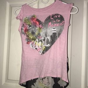 Pink hole in shoulder shirt